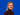 Bild zeigt Marie-Louise Völkel vor blauem Hintergrund, lächelnd in die Kamera