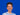 Bild zeigt Julian Kaiser vor blauem Hintergrund, lächelnd in die Kamera