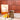 Pumpkin Oat Latte Verpackung im Hintergrund, davor ein zubereiteter Drink, daneben drapierte Orangen und Zimtstangen