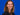Bild zeigt Janina Müller vor blauem Hintergrund, lächelnd in die Kamera